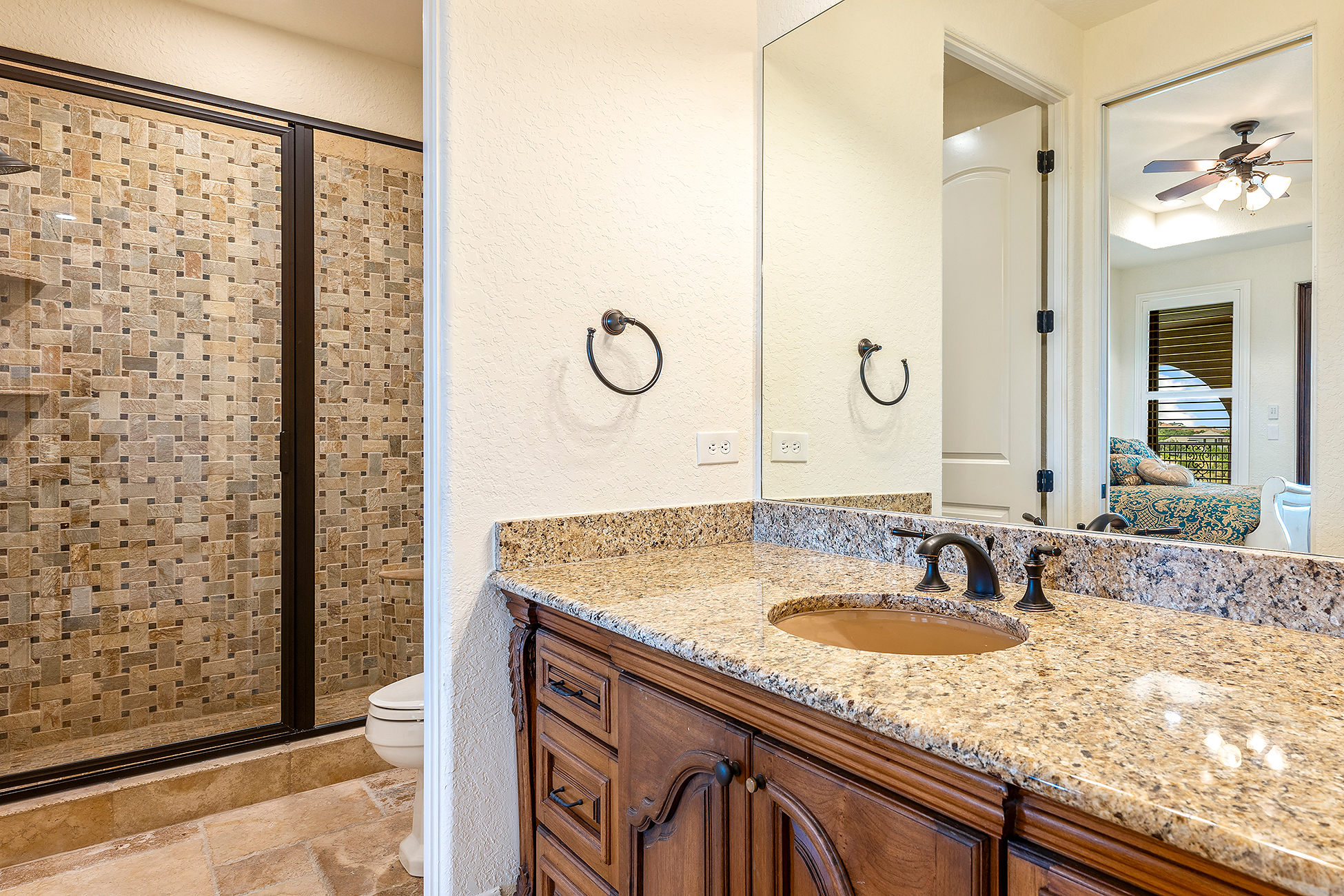 Renovated kitchen with white cabinetry, large island, and pendant lighting in Wilmington NC