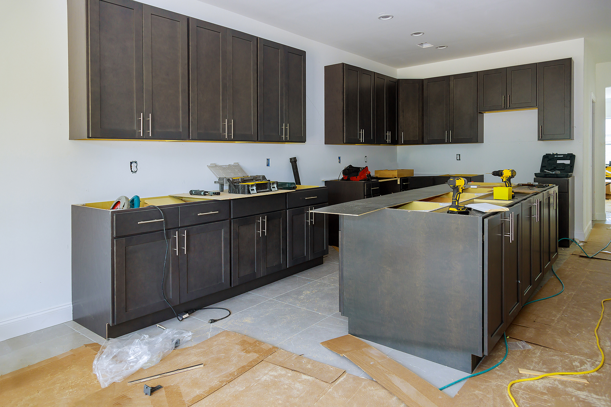 Before and after kitchen remodel showing updated layout, cabinetry, and lighting