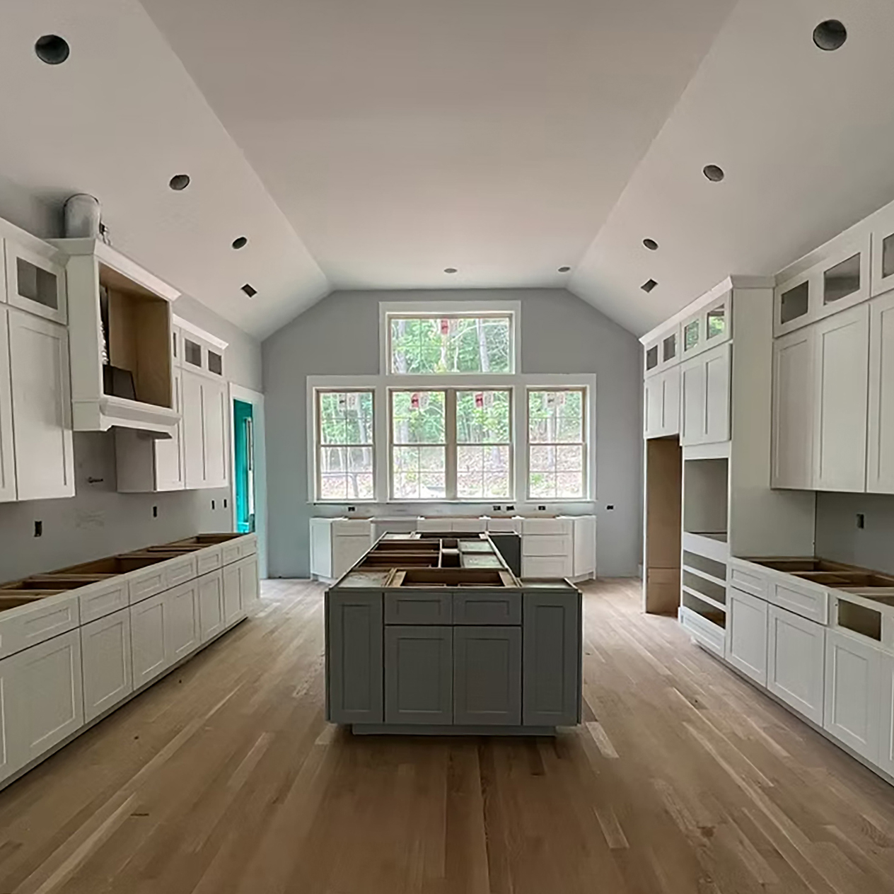Kitchen renovation with spacious island seating and updated lighting